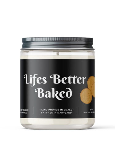 Candle jar with Funny 'Lifes Better Baked' label on a white background